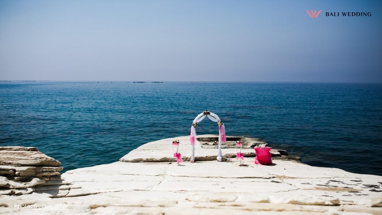 Pink wedding altar stands on the stones