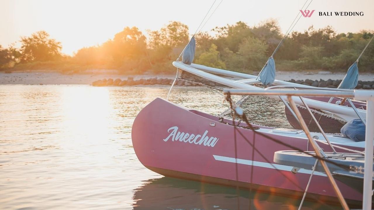 Aneecha boat at sunset with a beach background