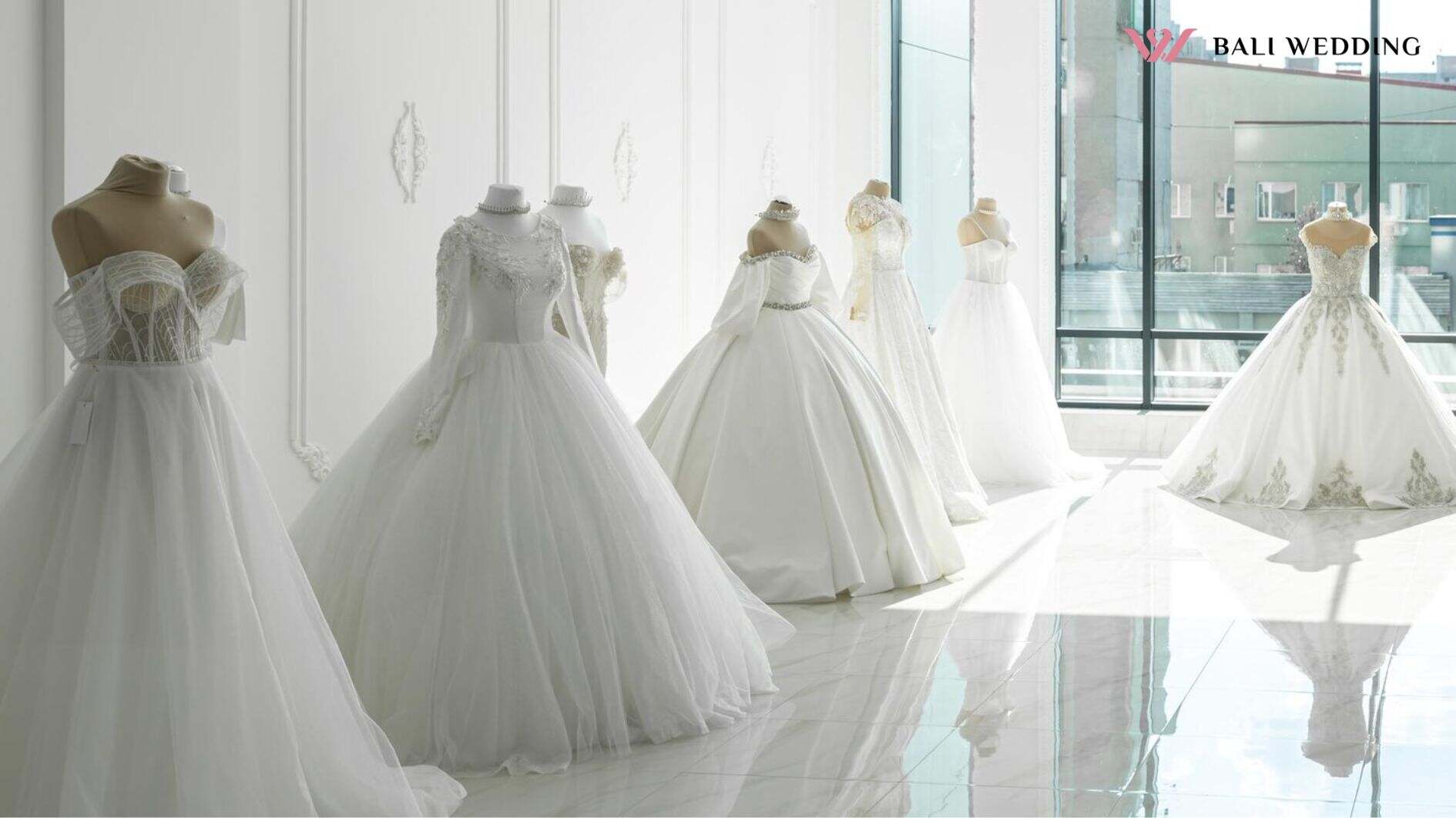 Beautiful wedding bridal dresses on mannequin in showroom in mall