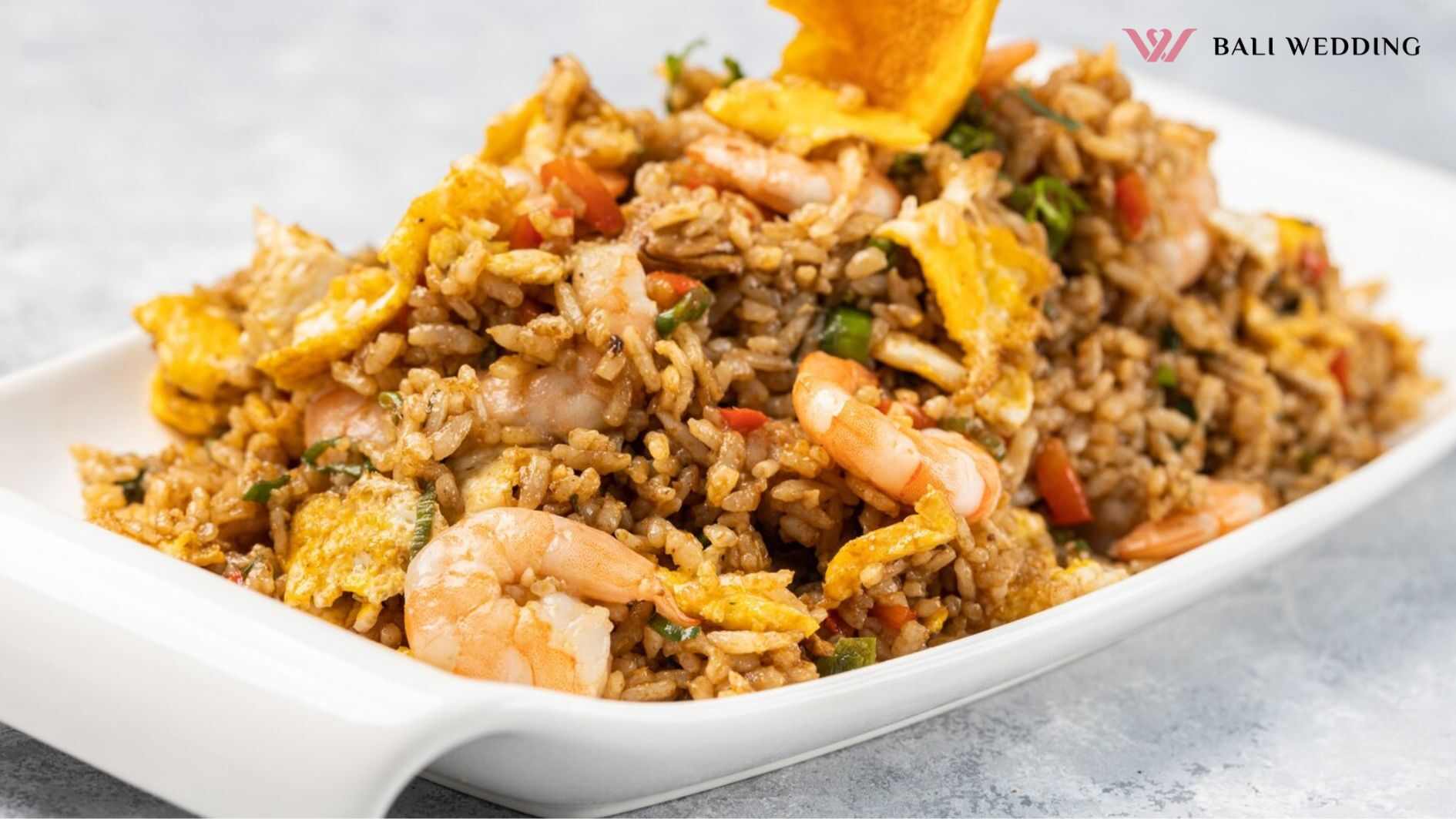 Closeup of spicy cooked rice with meat, shrimp and vegetables in a plate