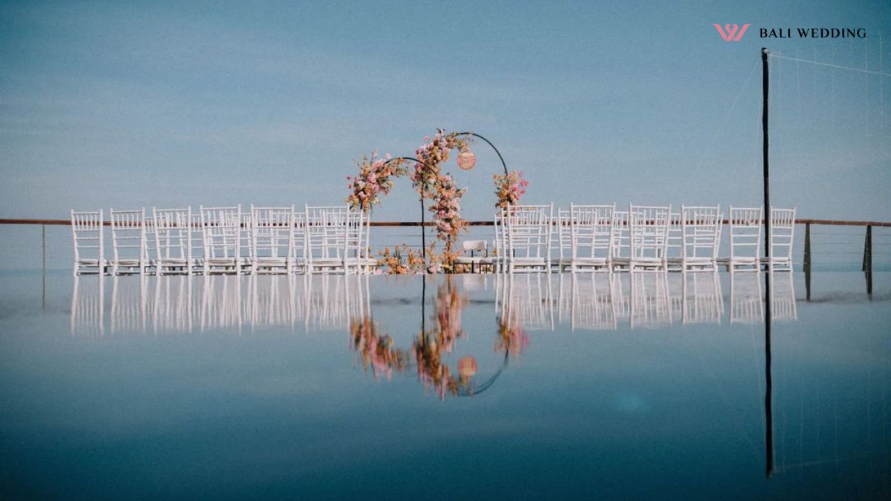 Guest chairs with water reflection at wedding venue