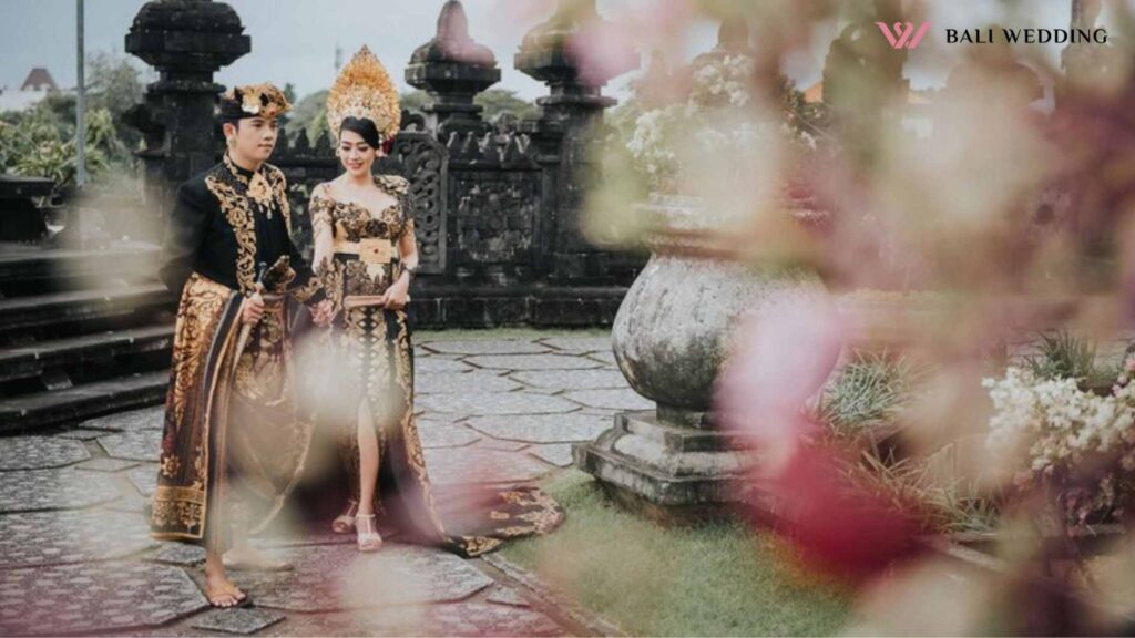 People in traditional clothing walking at temple