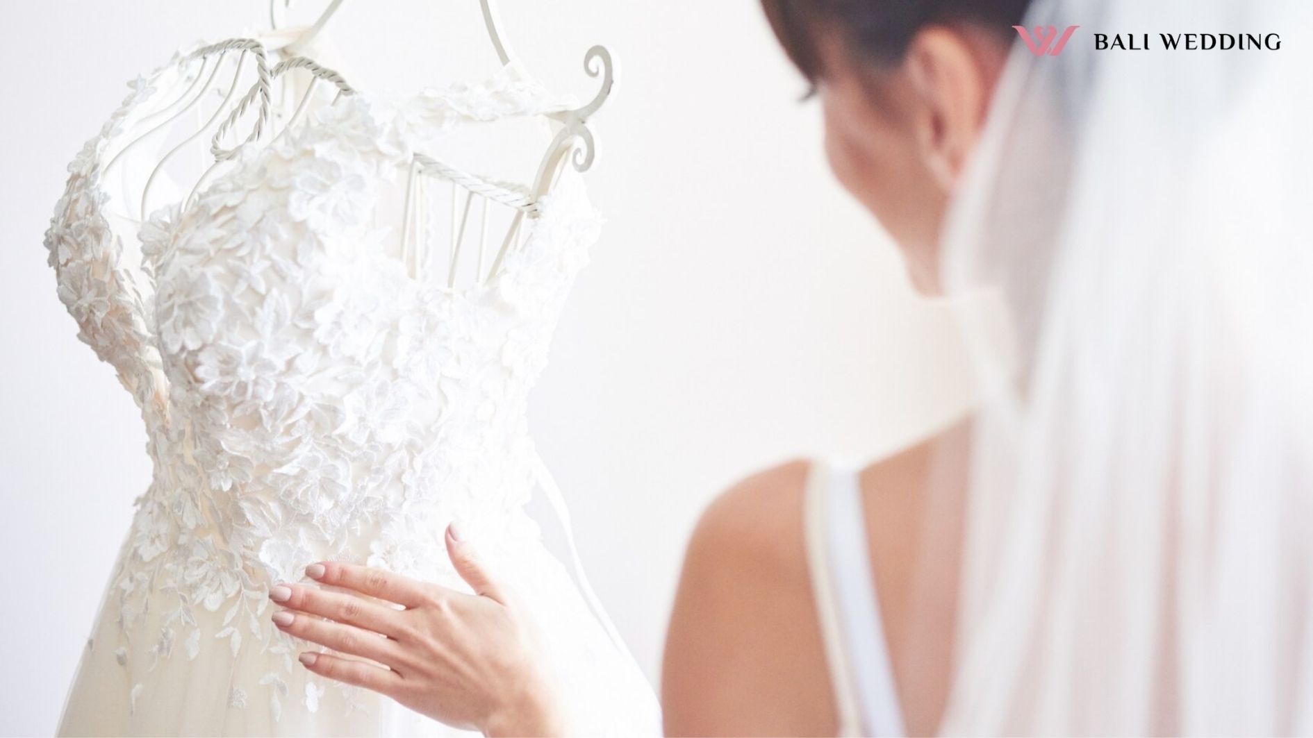 Elegant bride puts a wedding gown in her room