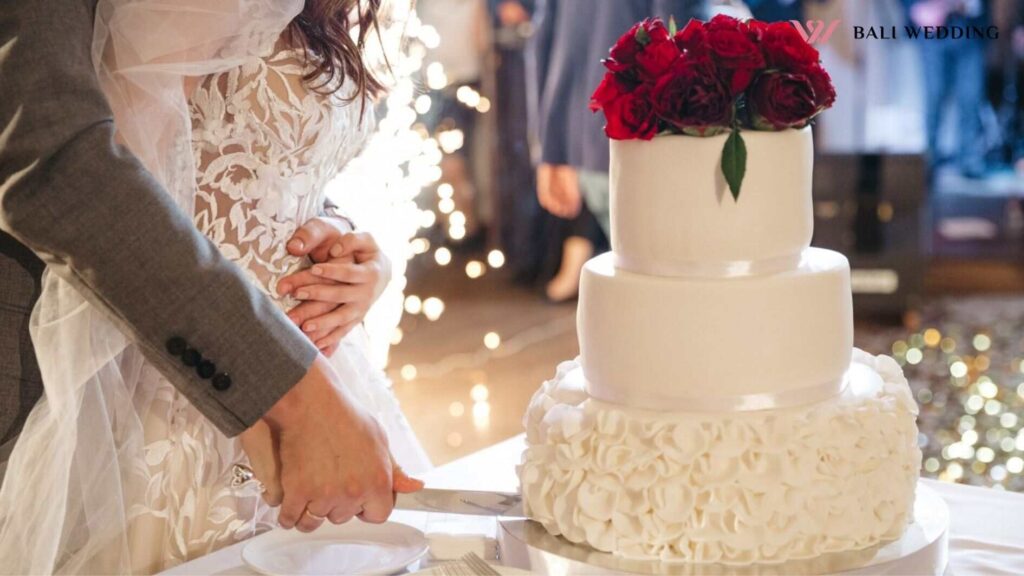 Happy bride and groom cut a wedding cake