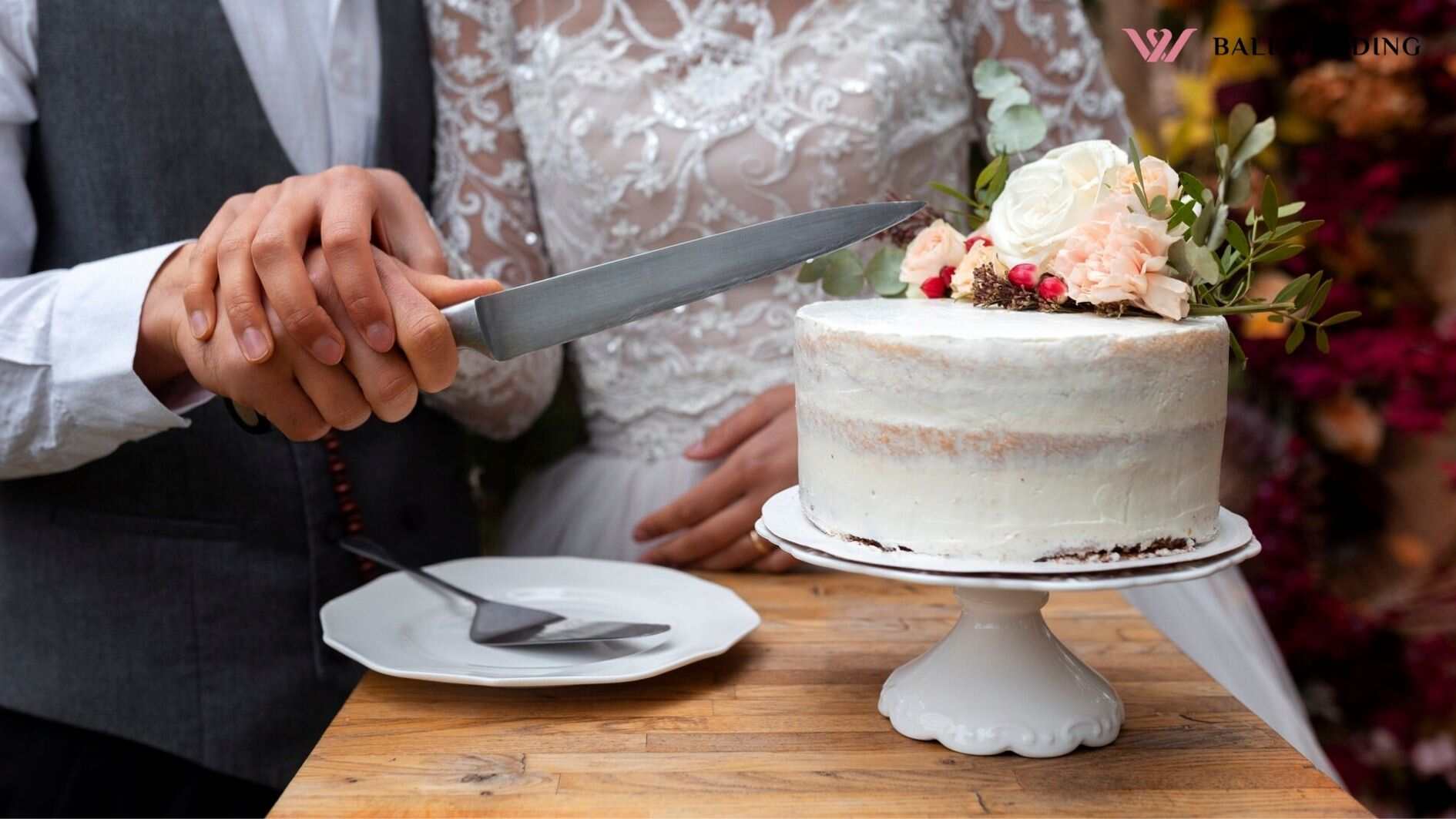 Front view couple cutting cake